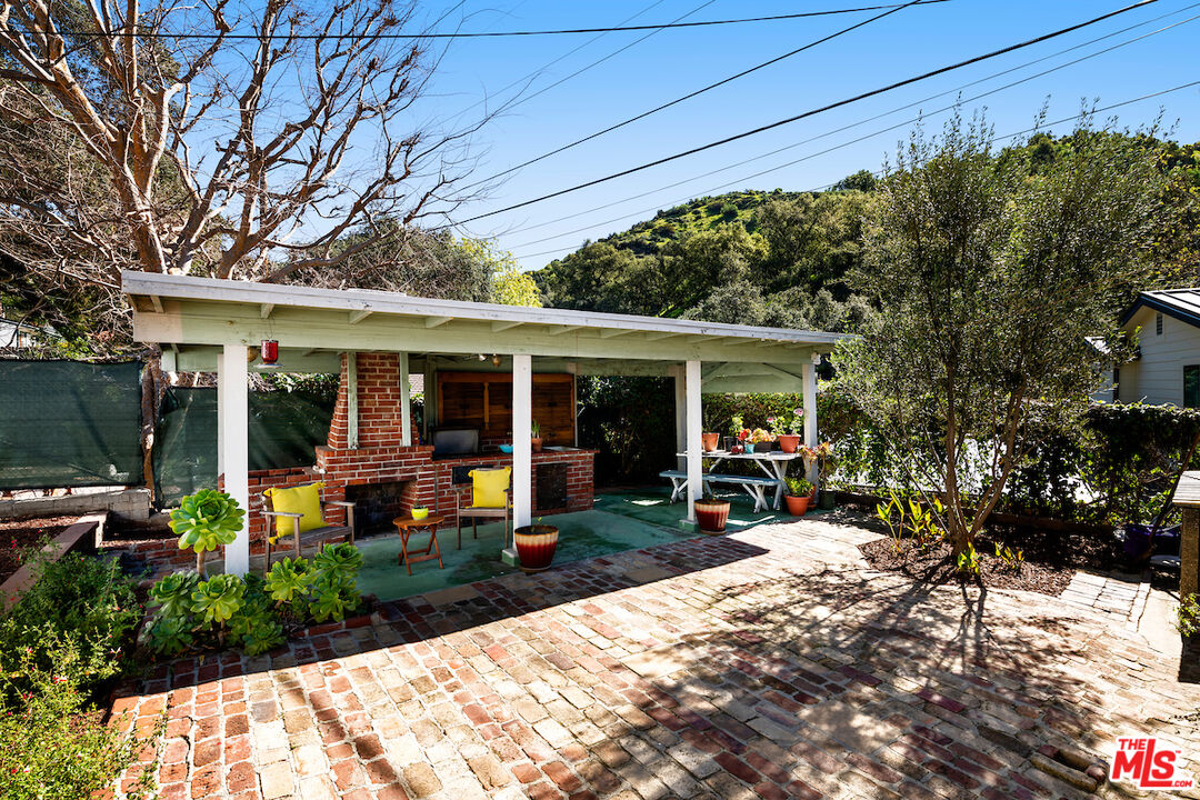1856 Alpha Road Glendale, CA 91208 - Photo 29 of 32 a view of a house with sitting area and garden