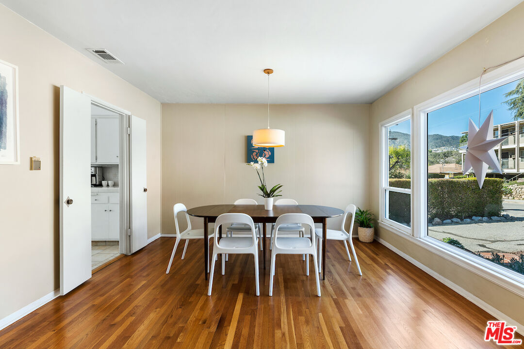 1856 Alpha Road Glendale, CA 91208 - Photo 8 of 32 a view of a dining room with furniture window and wooden floor