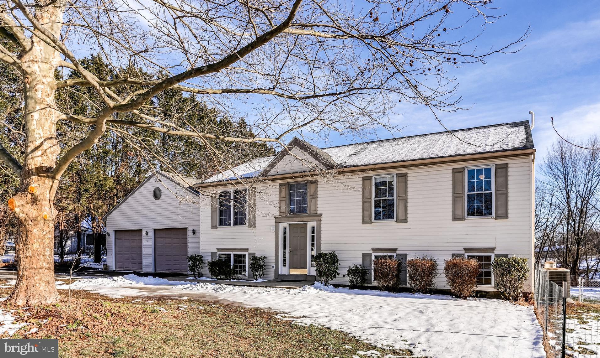 4939 A Elmer Derr Road Frederick, MD 21703 - Photo 1 of 29 a view of a house with a yard covered with snow