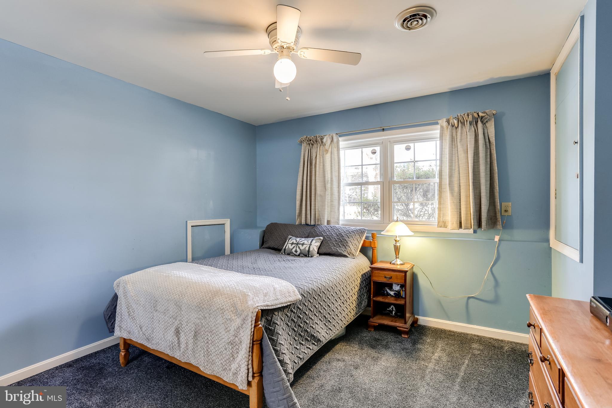 4939 A Elmer Derr Road Frederick, MD 21703 - Photo 17 of 29 a bedroom with a bed and a window