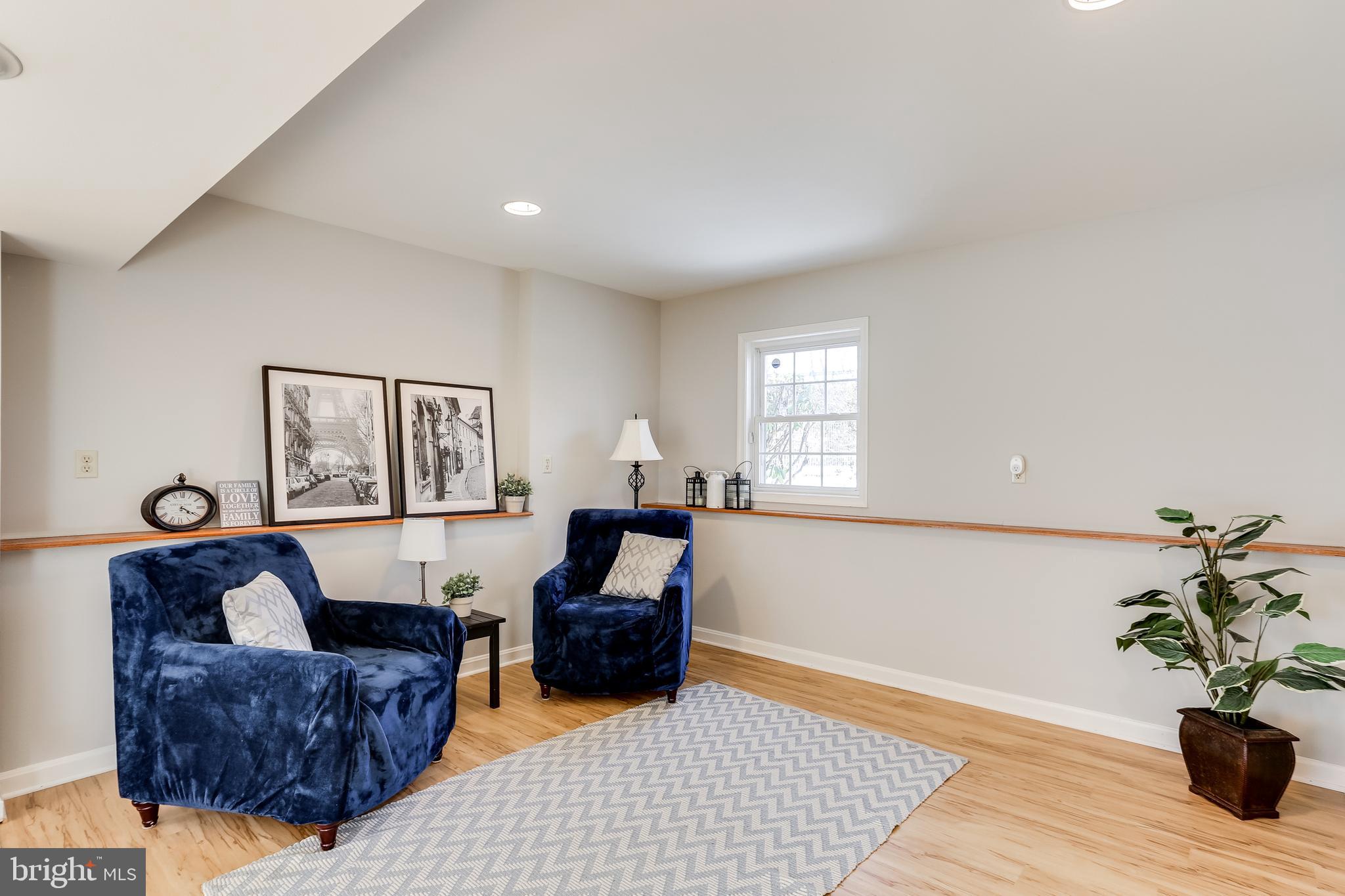 4939 A Elmer Derr Road Frederick, MD 21703 - Photo 20 of 29 a living room with furniture and a potted plant