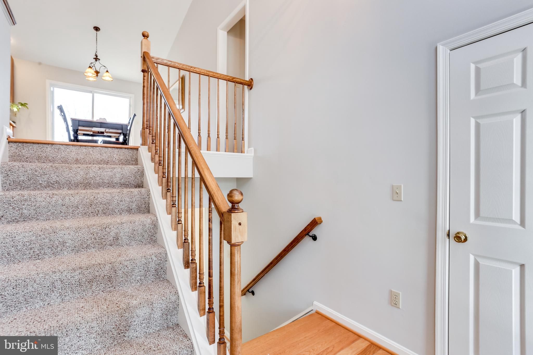 4939 A Elmer Derr Road Frederick, MD 21703 - Photo 3 of 29 a view of staircase with white walls and a window