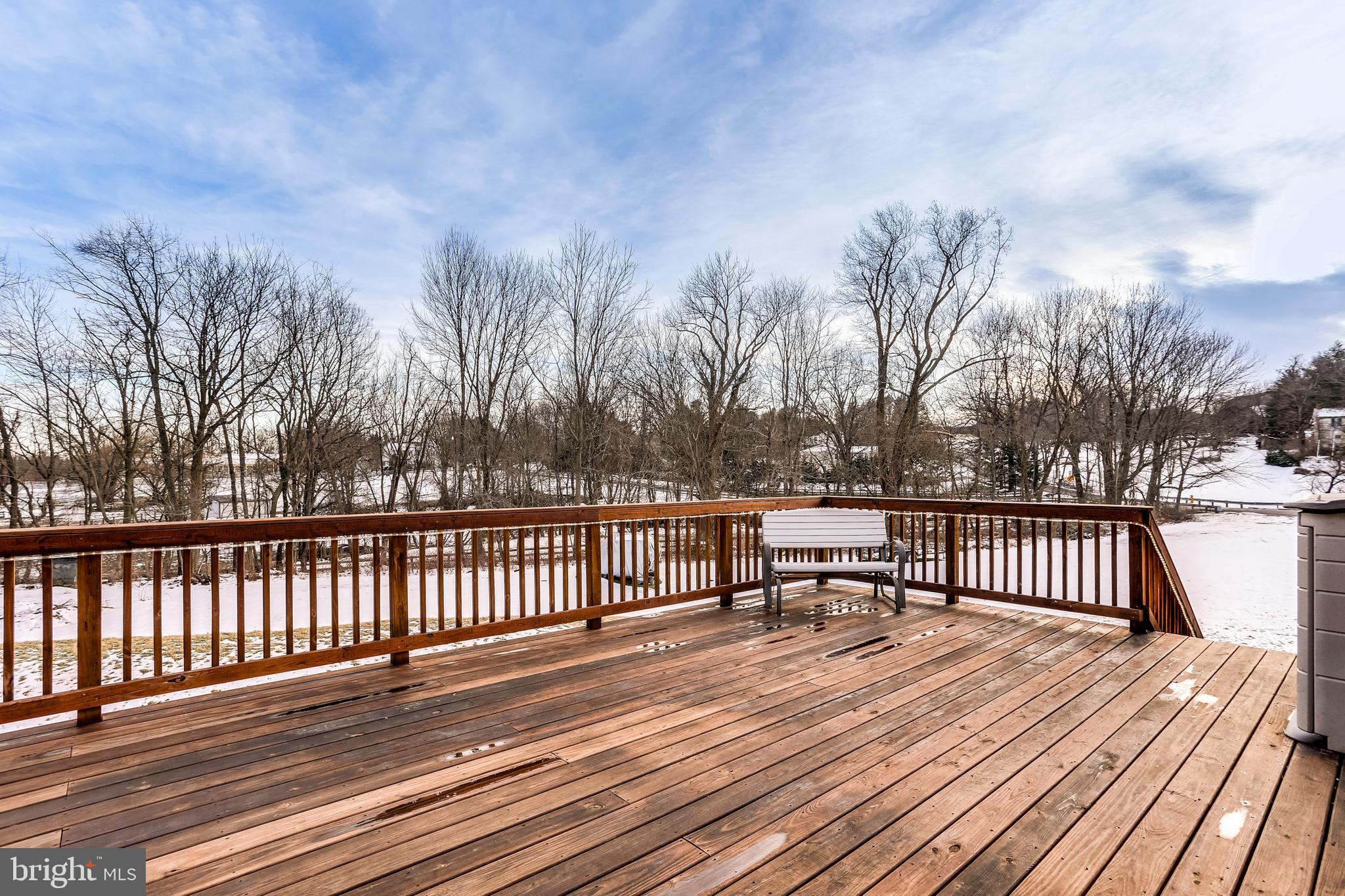 4939 A Elmer Derr Road Frederick, MD 21703 - Photo 23 of 29 a view of balcony with wooden floor and fence
