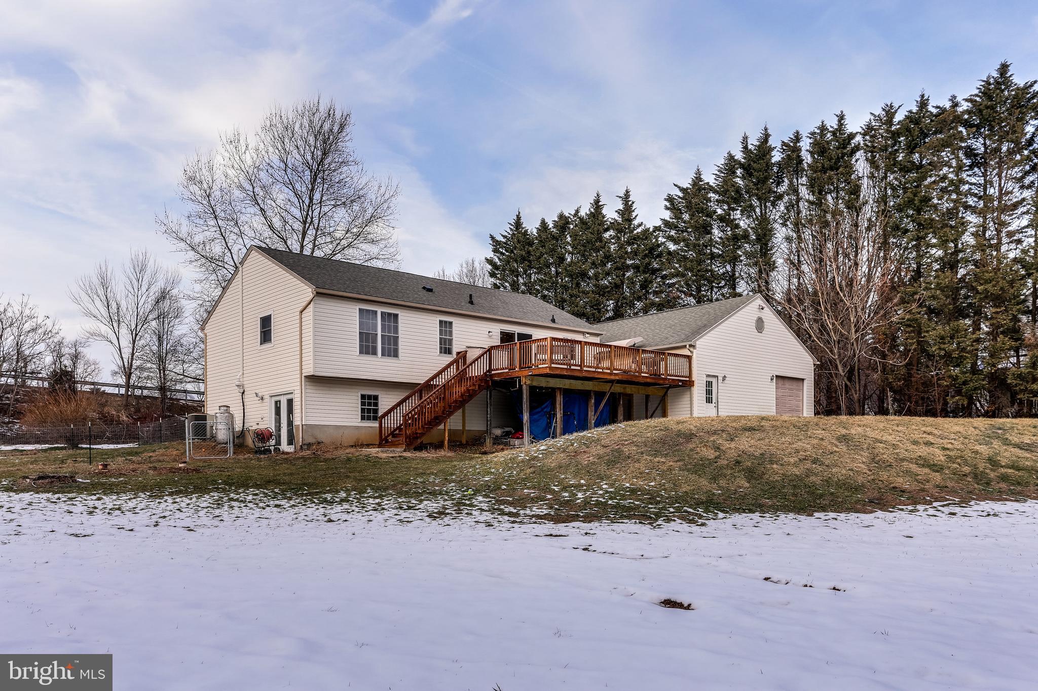 4939 A Elmer Derr Road Frederick, MD 21703 - Photo 26 of 29 a front view of a house with a yard