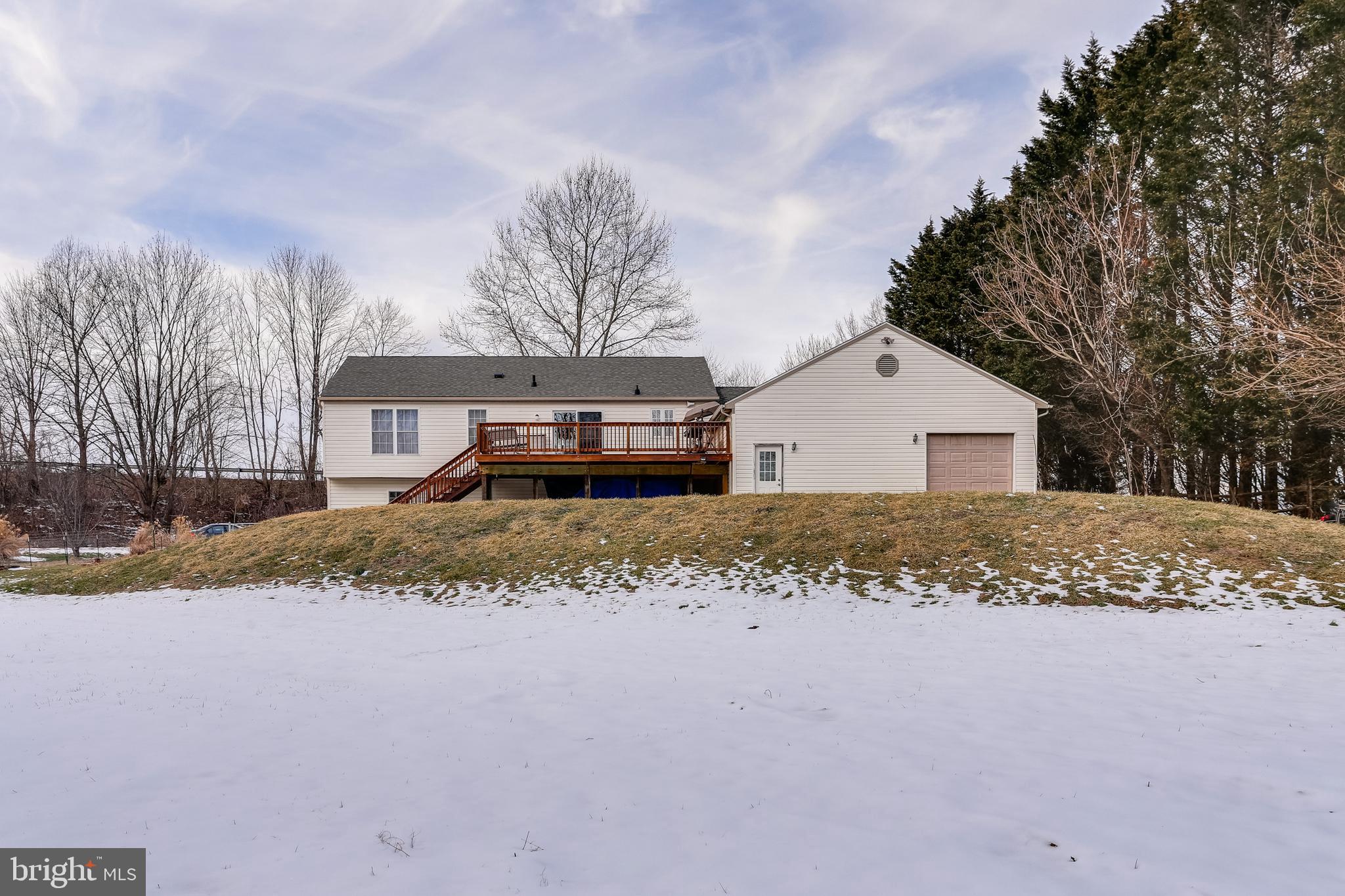 4939 A Elmer Derr Road Frederick, MD 21703 - Photo 27 of 29 a view of a white house with a yard covered in snow