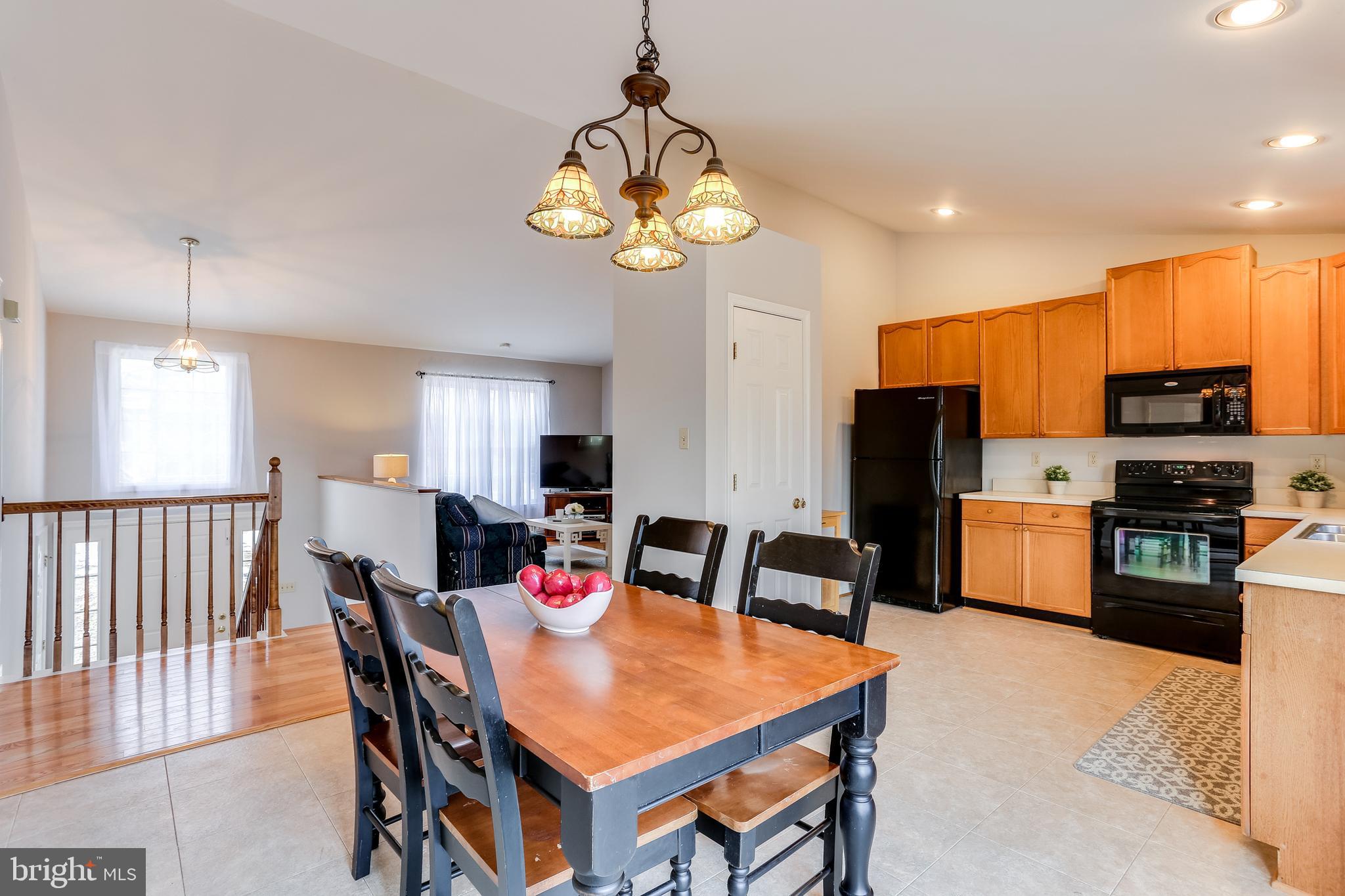 4939 A Elmer Derr Road Frederick, MD 21703 - Photo 6 of 29 a view of a dining room with furniture
