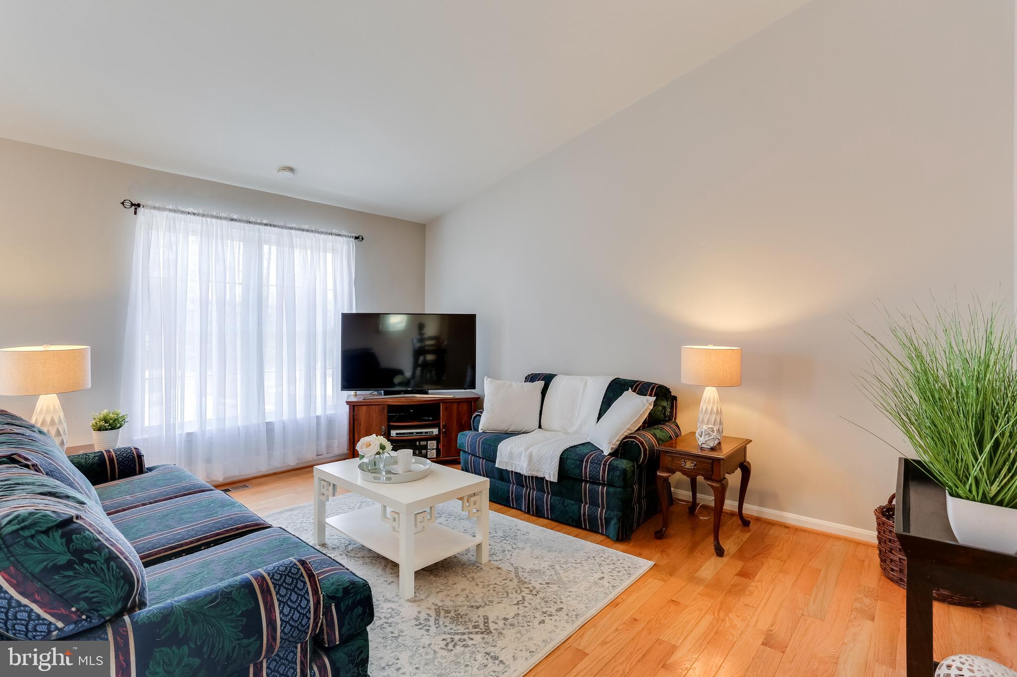 4939 A Elmer Derr Road Frederick, MD 21703 - Photo 7 of 29 a living room with furniture and a flat screen tv