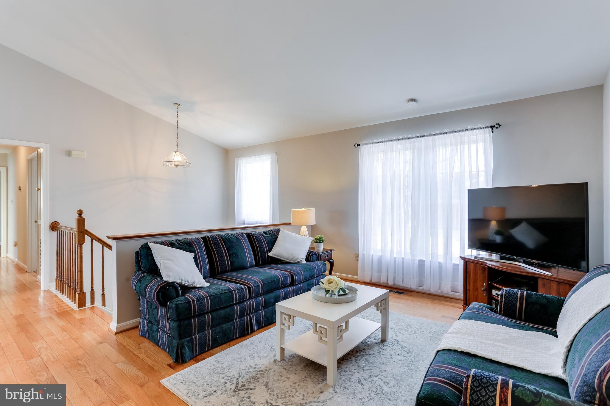 4939 A Elmer Derr Road Frederick, MD 21703 - Photo 10 of 29 a living room with furniture and a flat screen tv