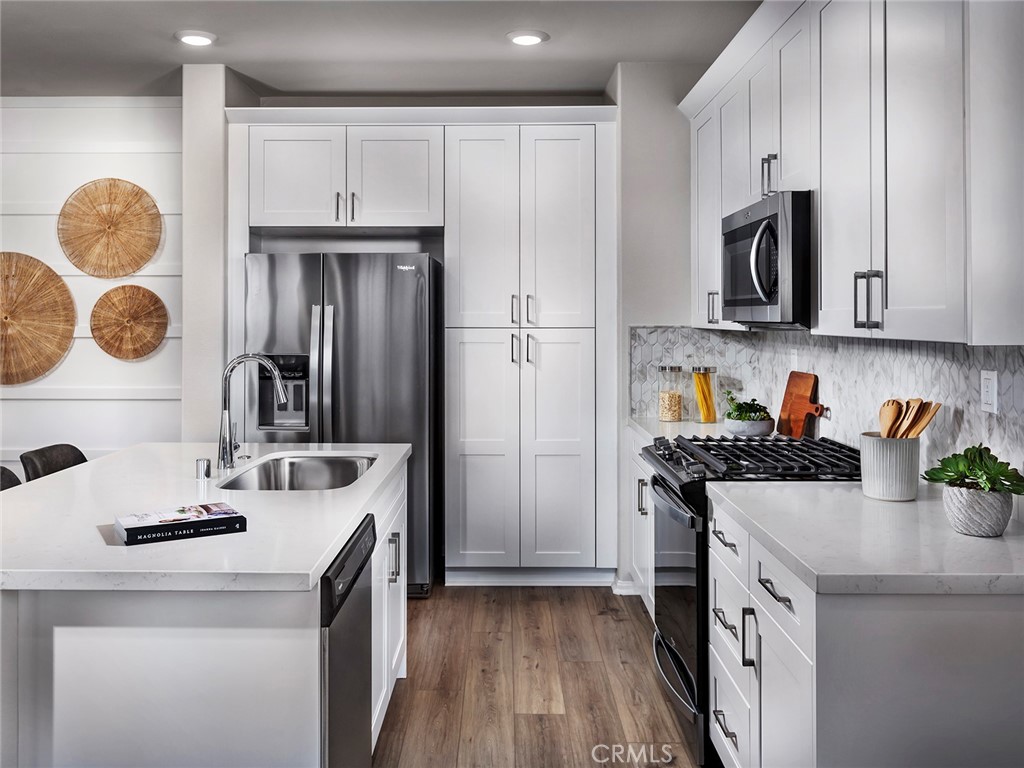202 Palm Road San Marcos, CA 92069 - Photo 3 of 12 a kitchen with stainless steel appliances granite countertop a sink stove and refrigerator