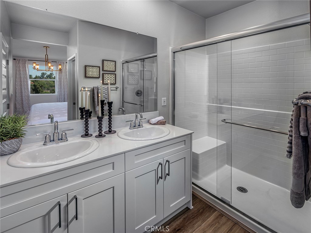 202 Palm Road San Marcos, CA 92069 - Photo 7 of 12 a bathroom with a shower sink and mirror