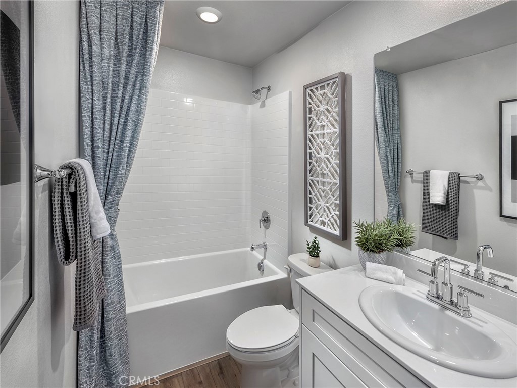 202 Palm Road San Marcos, CA 92069 - Photo 10 of 12 a bathroom with a sink a toilet and a bathtub