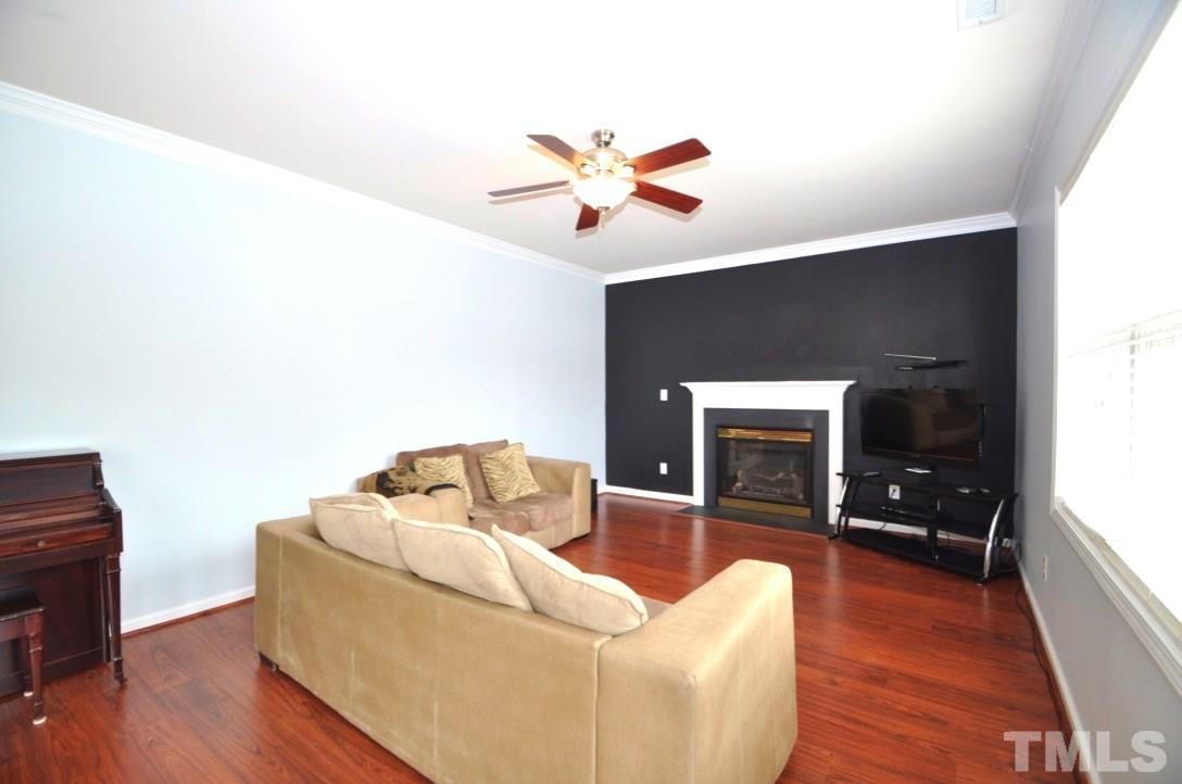 2529 Dality Drive Raleigh, NC 27604 - Photo 5 of 20 a living room with furniture and a flat screen tv