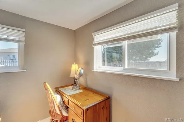a workspace with furniture and window