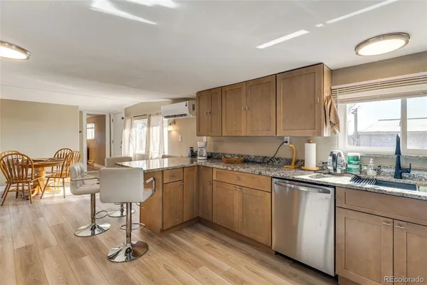 a kitchen with sink cabinets and dining table