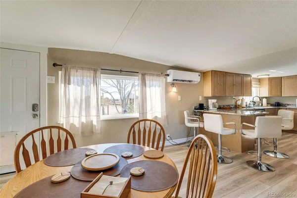 a view of a dining room with furniture window and wooden floor
