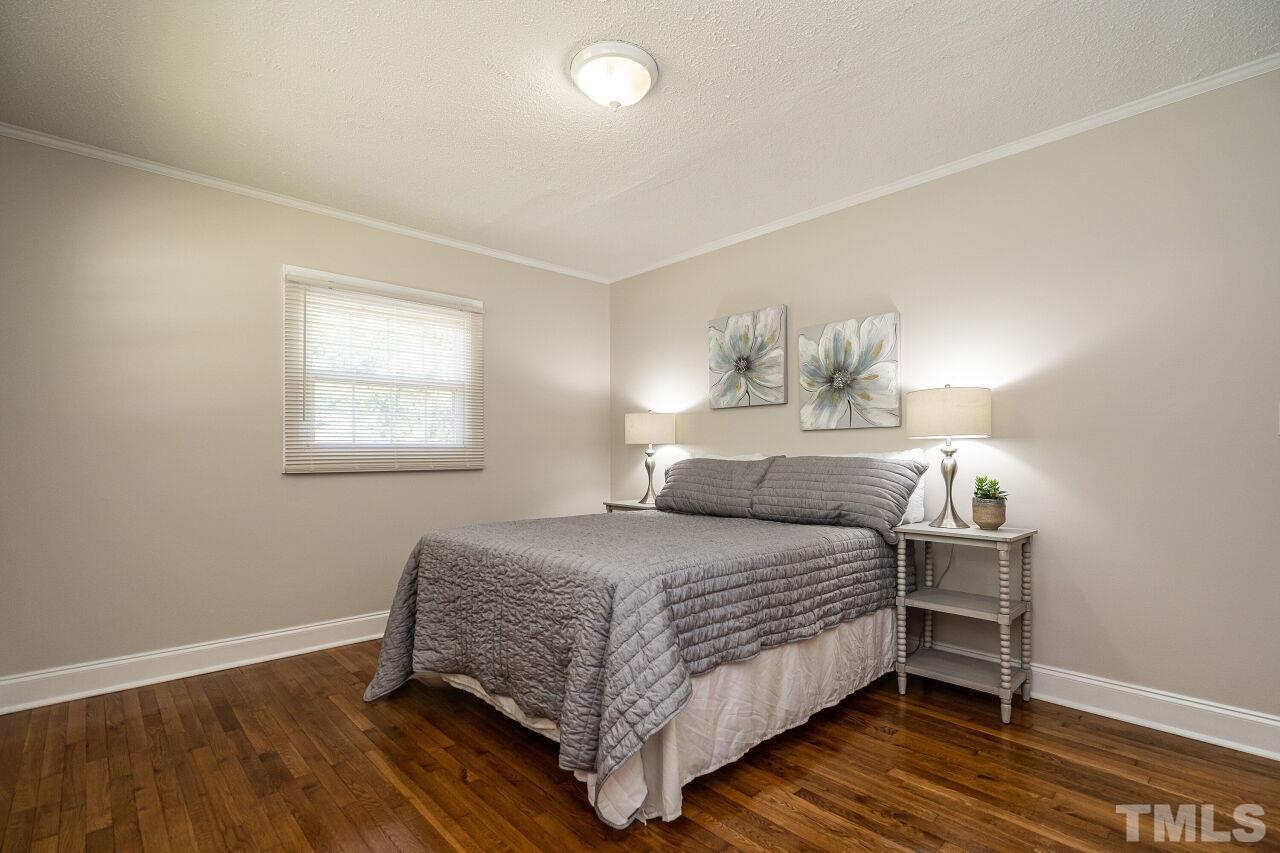 202 Purvis Street Garner, NC 27529 - Photo 14 of 29 a bedroom with a bed and window