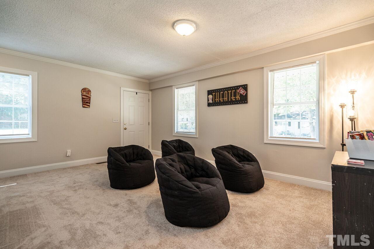 202 Purvis Street Garner, NC 27529 - Photo 19 of 29 a living room with furniture and a window