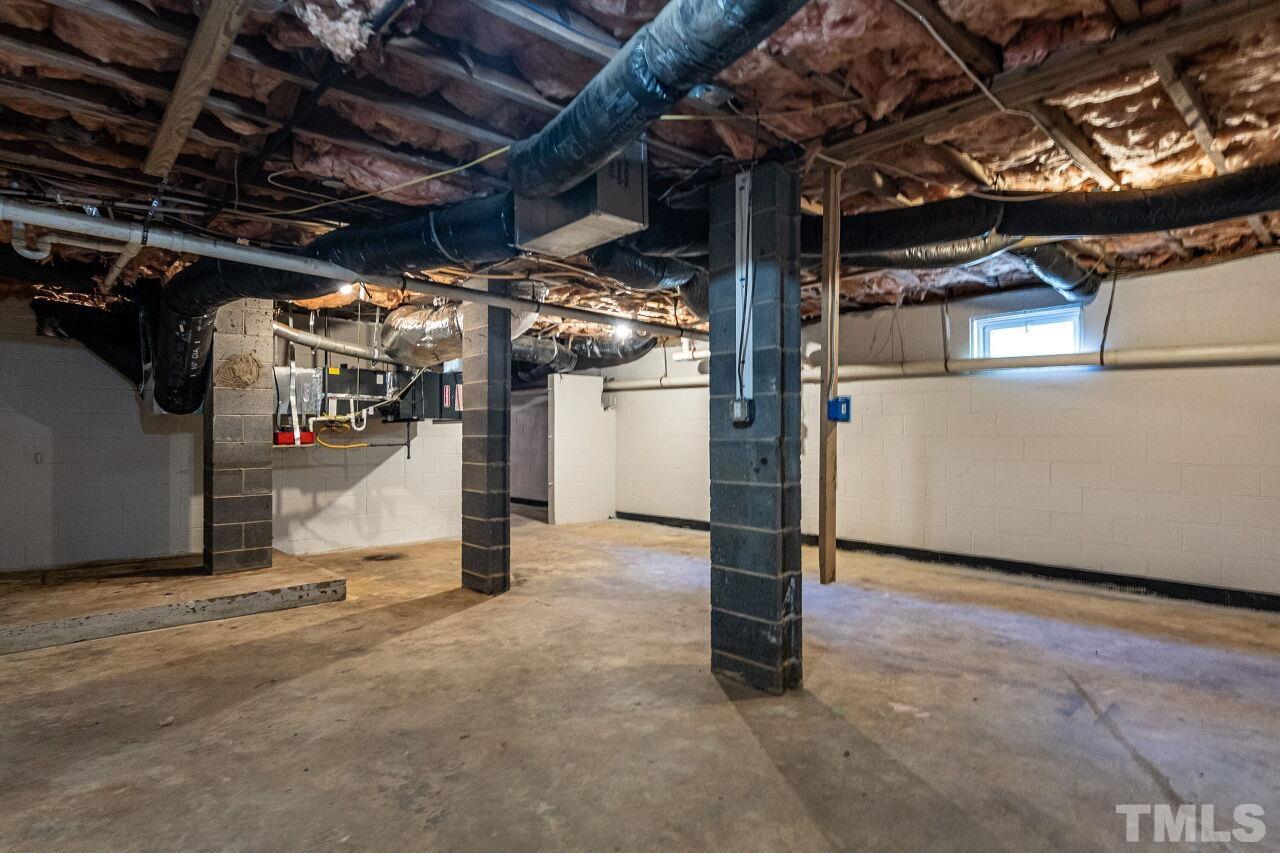 202 Purvis Street Garner, NC 27529 - Photo 24 of 29 a view of empty room with wooden floor
