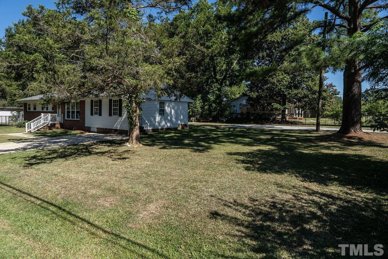 202 Purvis Street Garner, NC 27529 - Photo 25 of 29 a backyard of a house with barbeque oven