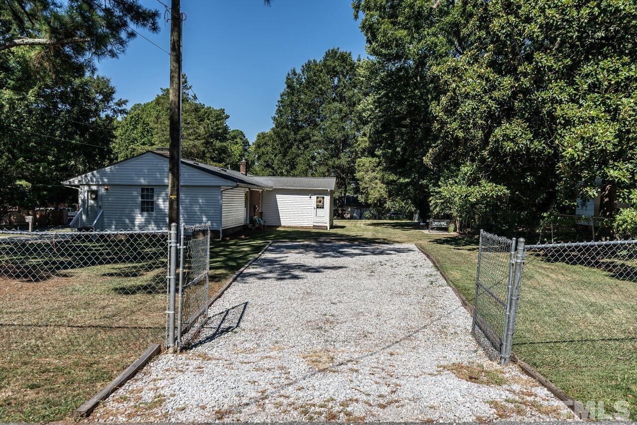 202 Purvis Street Garner, NC 27529 - Photo 26 of 29 a view of a house with backyard and trees