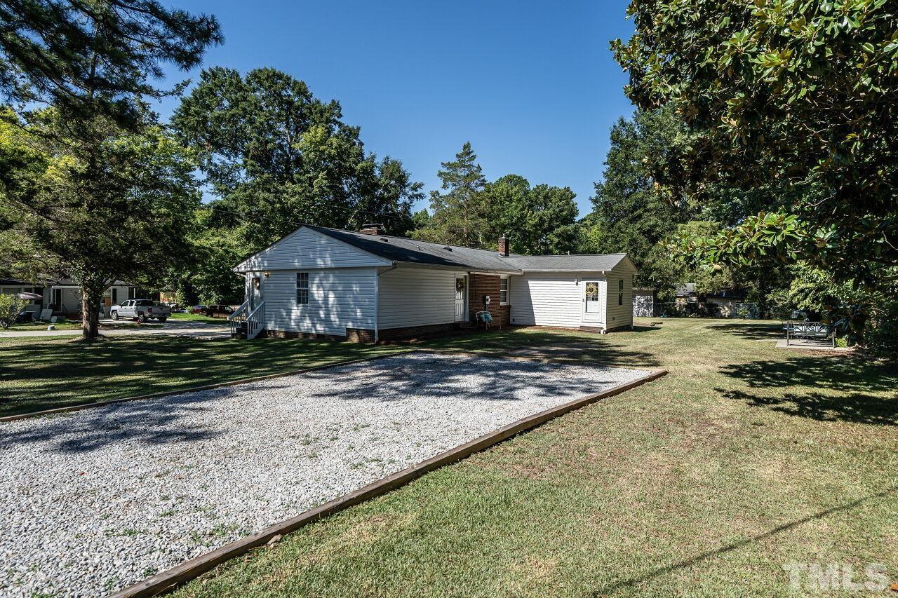 202 Purvis Street Garner, NC 27529 - Photo 27 of 29 a view of a house with backyard and trees