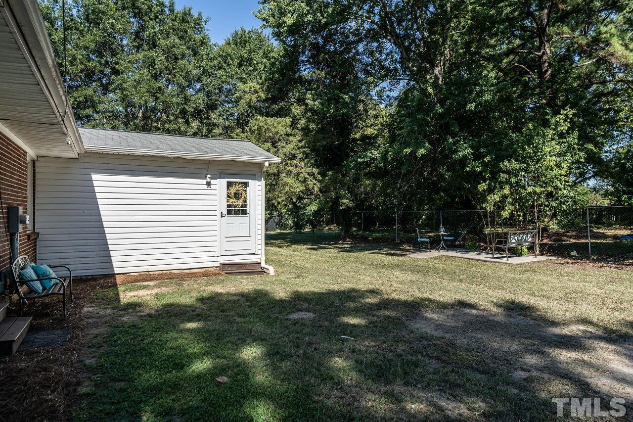 202 Purvis Street Garner, NC 27529 - Photo 28 of 29 a view of a backyard with large trees