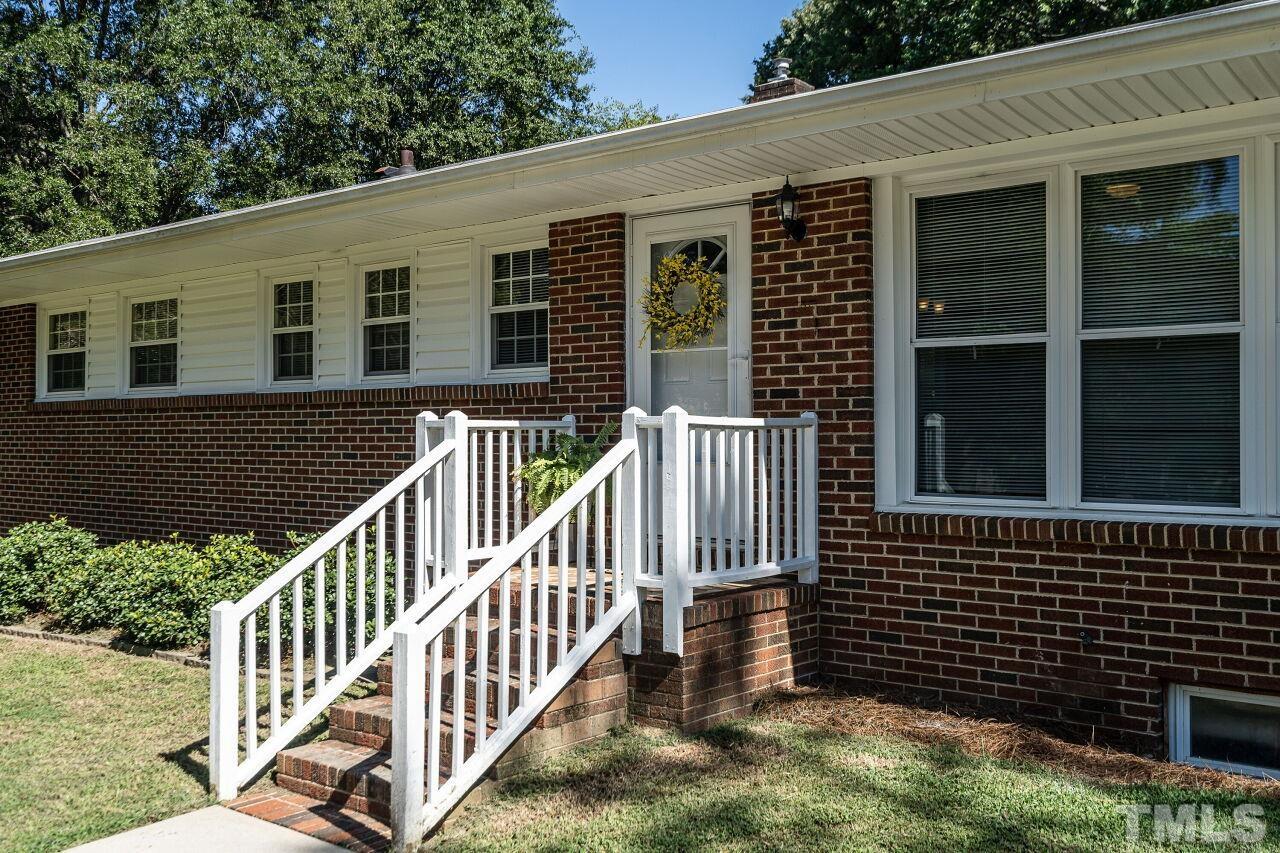 202 Purvis Street Garner, NC 27529 - Photo 3 of 29 a view of a house with backyard and porch