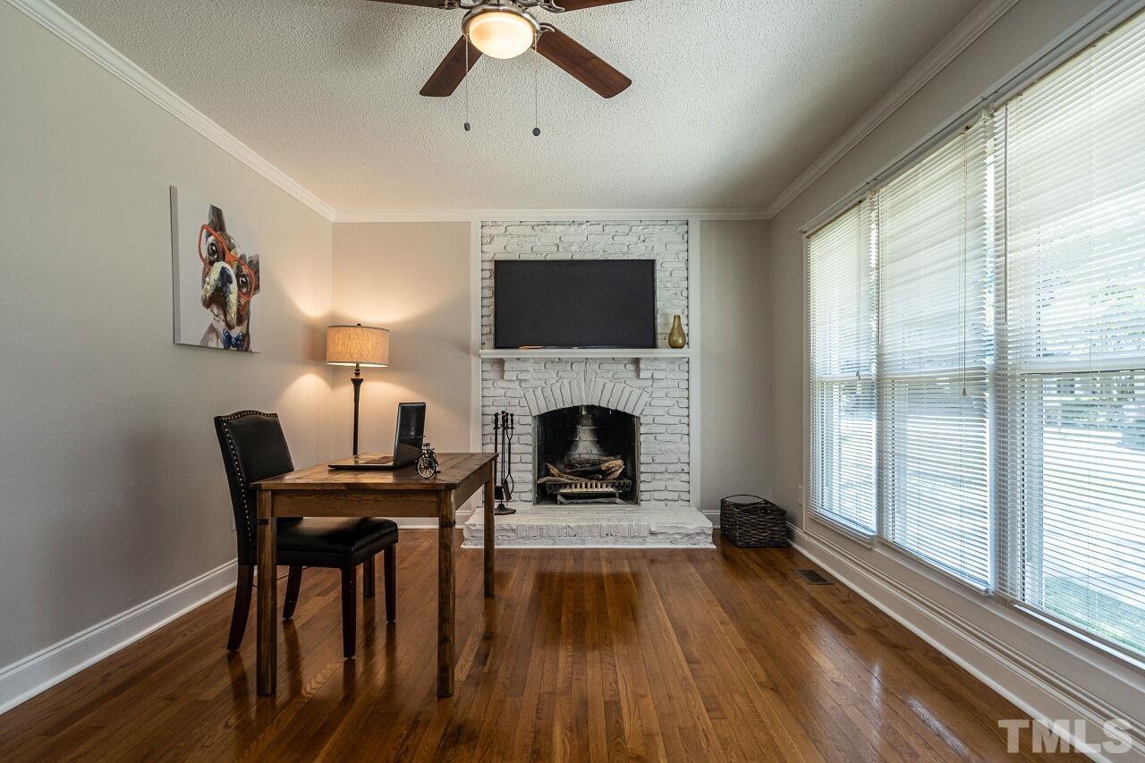 202 Purvis Street Garner, NC 27529 - Photo 5 of 29 a living room with furniture and a fireplace
