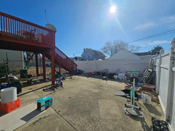 a view of a house with wooden deck