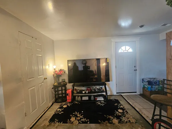 a room with furniture and a flat screen tv