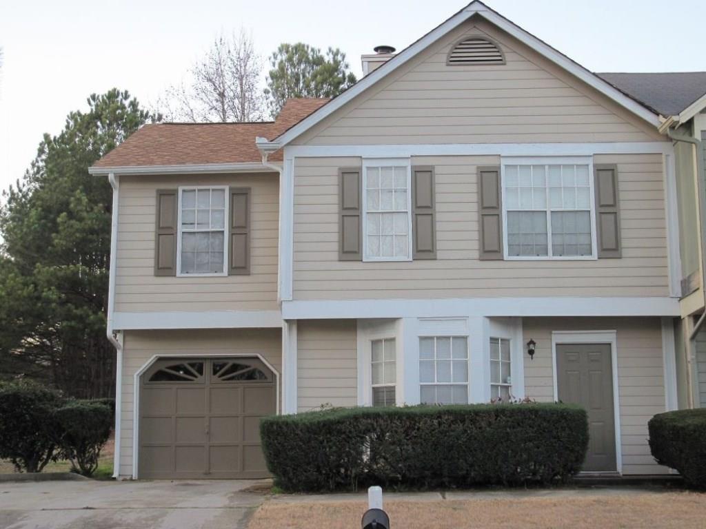 3833 Conley Downs Drive Decatur, GA 30034 - Photo 1 of 1 a front view of a house with garage
