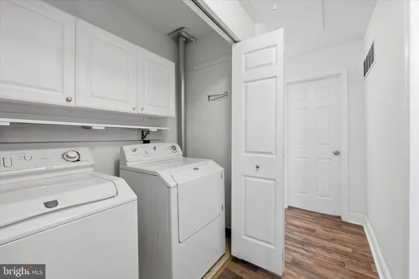 a view of storage and utility room with washer and dryer