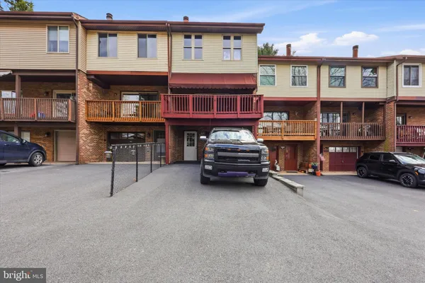 a view of building with cars