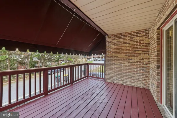 a balcony with wooden floor