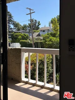a view of a balcony with an outdoor space