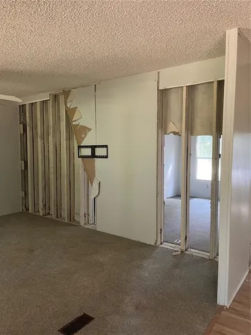 a bathroom with a toilet and a mirror