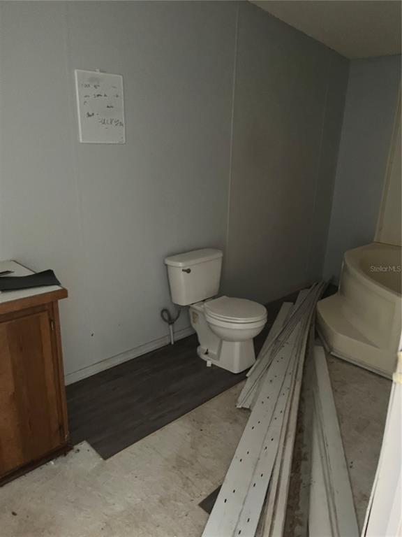 1130 Southwest 133rd Ave Road Ocala, FL 34481 - Photo 13 of 24 a bathroom with a toilet and a mirror
