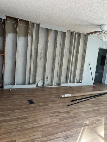 a white toilet sitting next to a shower