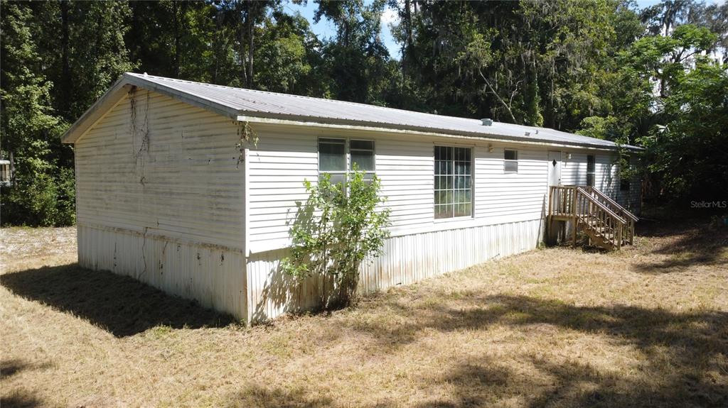 1130 Southwest 133rd Ave Road Ocala, FL 34481 - Photo 4 of 24 a view of a house with a yard