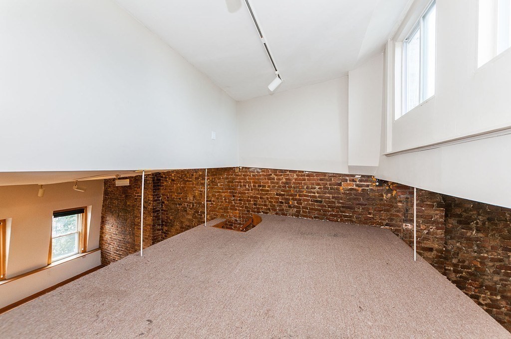11 Savin Hill Avenue Boston, MA 02125 - Photo 14 of 40 a view of an empty room with windows