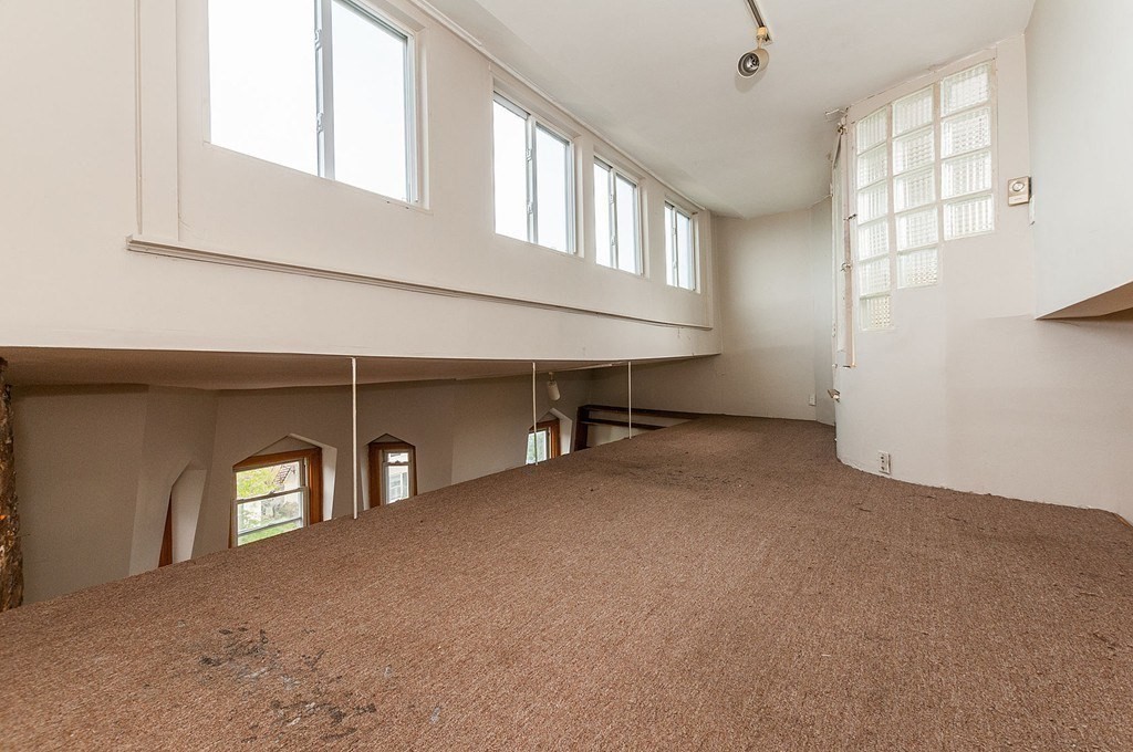 11 Savin Hill Avenue Boston, MA 02125 - Photo 15 of 40 a view of a livingroom with a staircase
