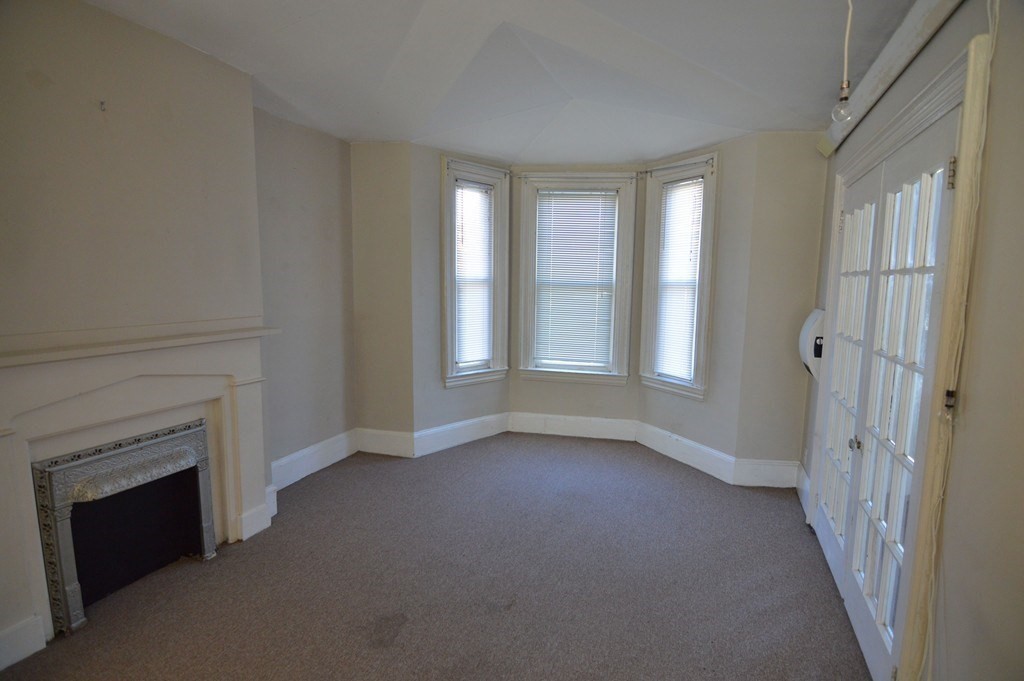 11 Savin Hill Avenue Boston, MA 02125 - Photo 19 of 40 a view of an empty room with a window