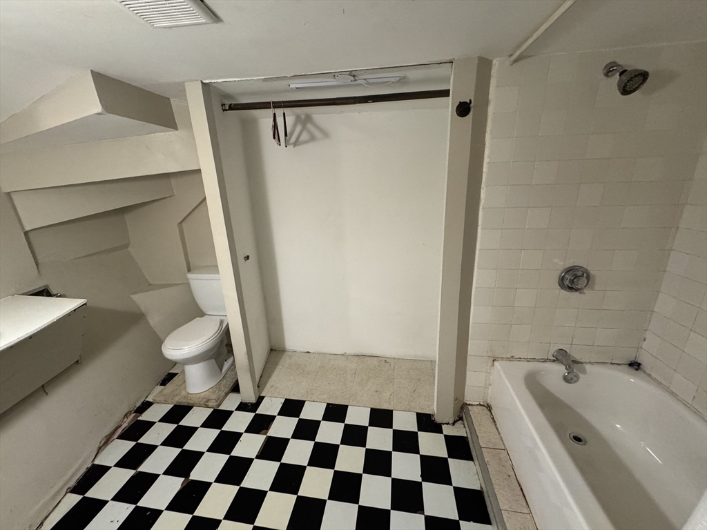 11 Savin Hill Avenue Boston, MA 02125 - Photo 28 of 40 a bathroom with a sink a toilet a shower and a mirror