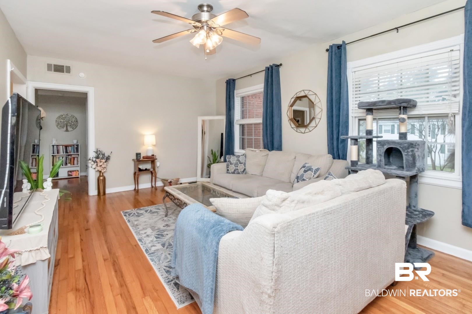 214 Upham Street, Unit 17C Mobile, AL 36607 - Photo 11 of 32 Living room featuring ceiling fan and light wood-style floors