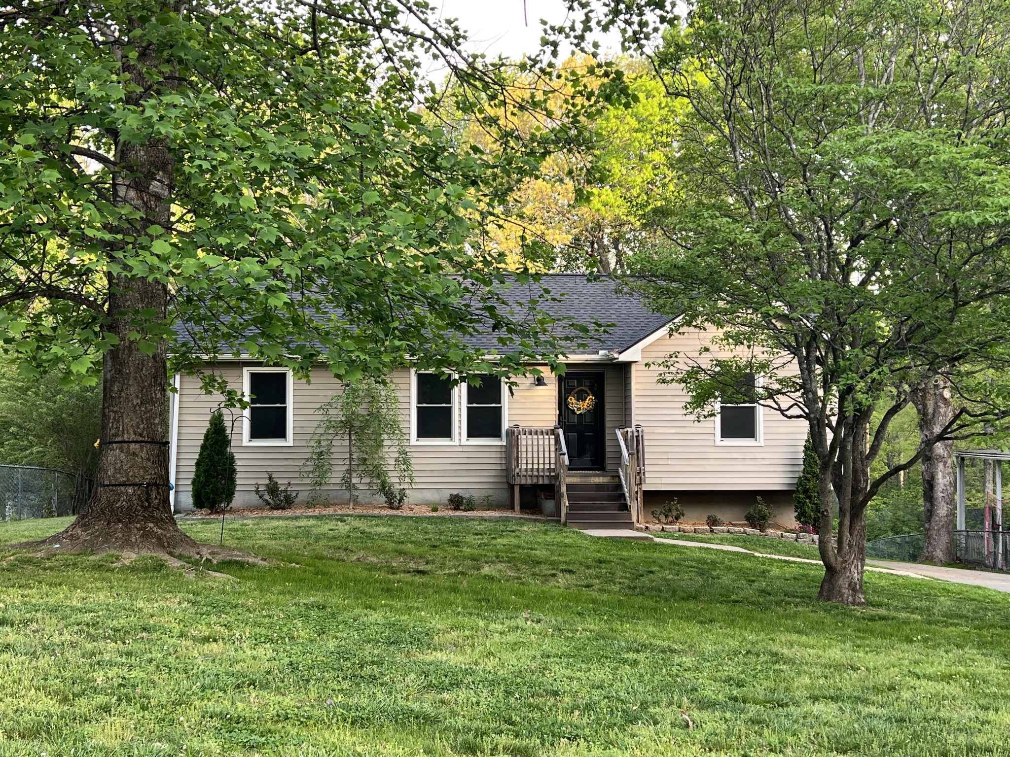 218 Quail Court Dickson, TN 37055 - Photo 1 of 22 a front view of house with yard and green space