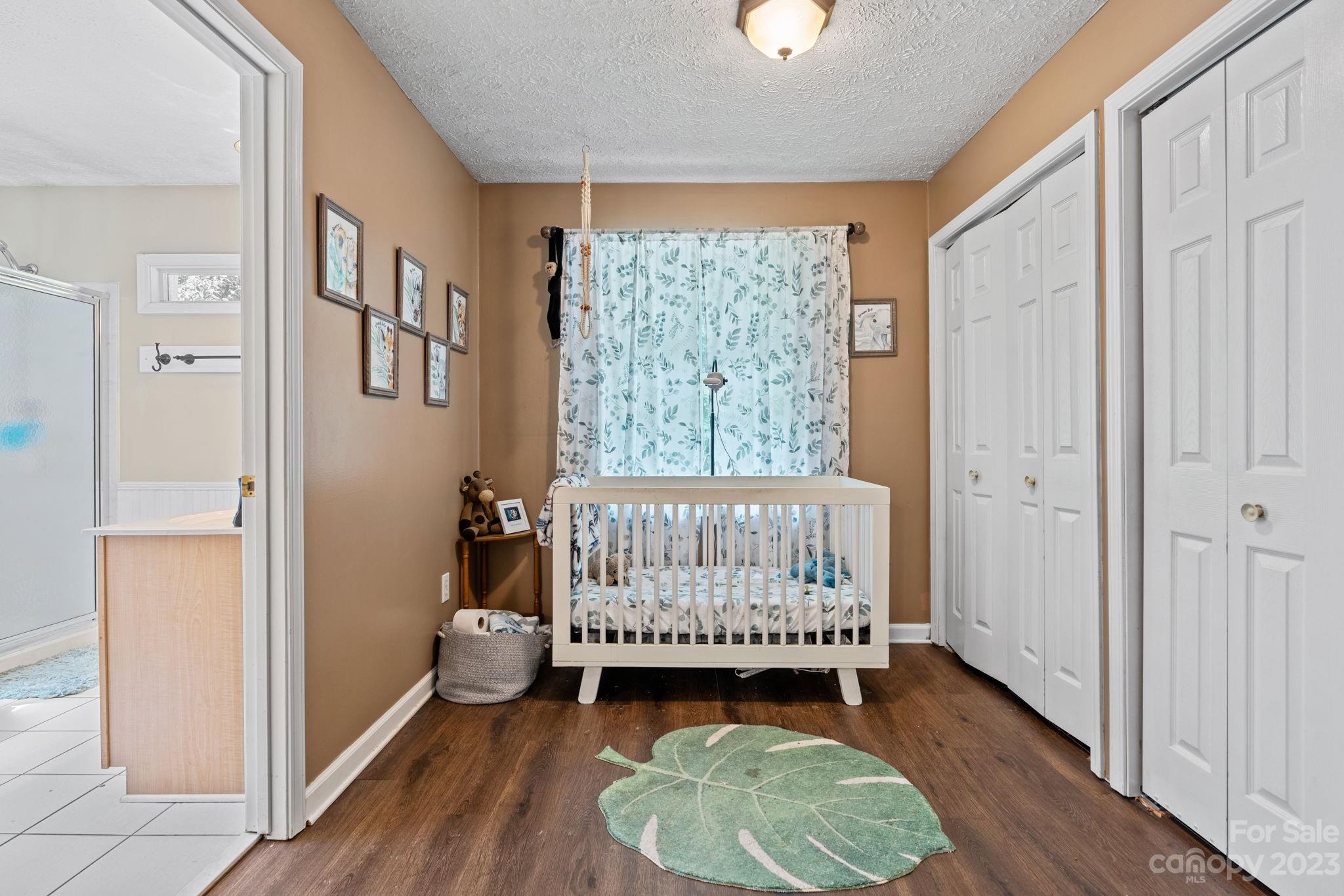 42 Bear Trail Fairview, NC 28730 - Photo 15 of 37 a bedroom with a bed and a window