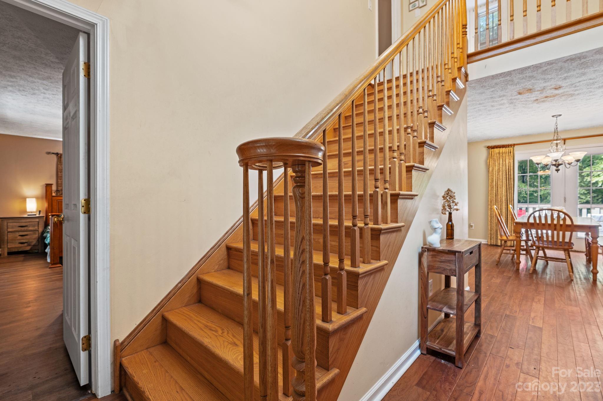 42 Bear Trail Fairview, NC 28730 - Photo 21 of 37 a view of entryway with wooden floor and stairs
