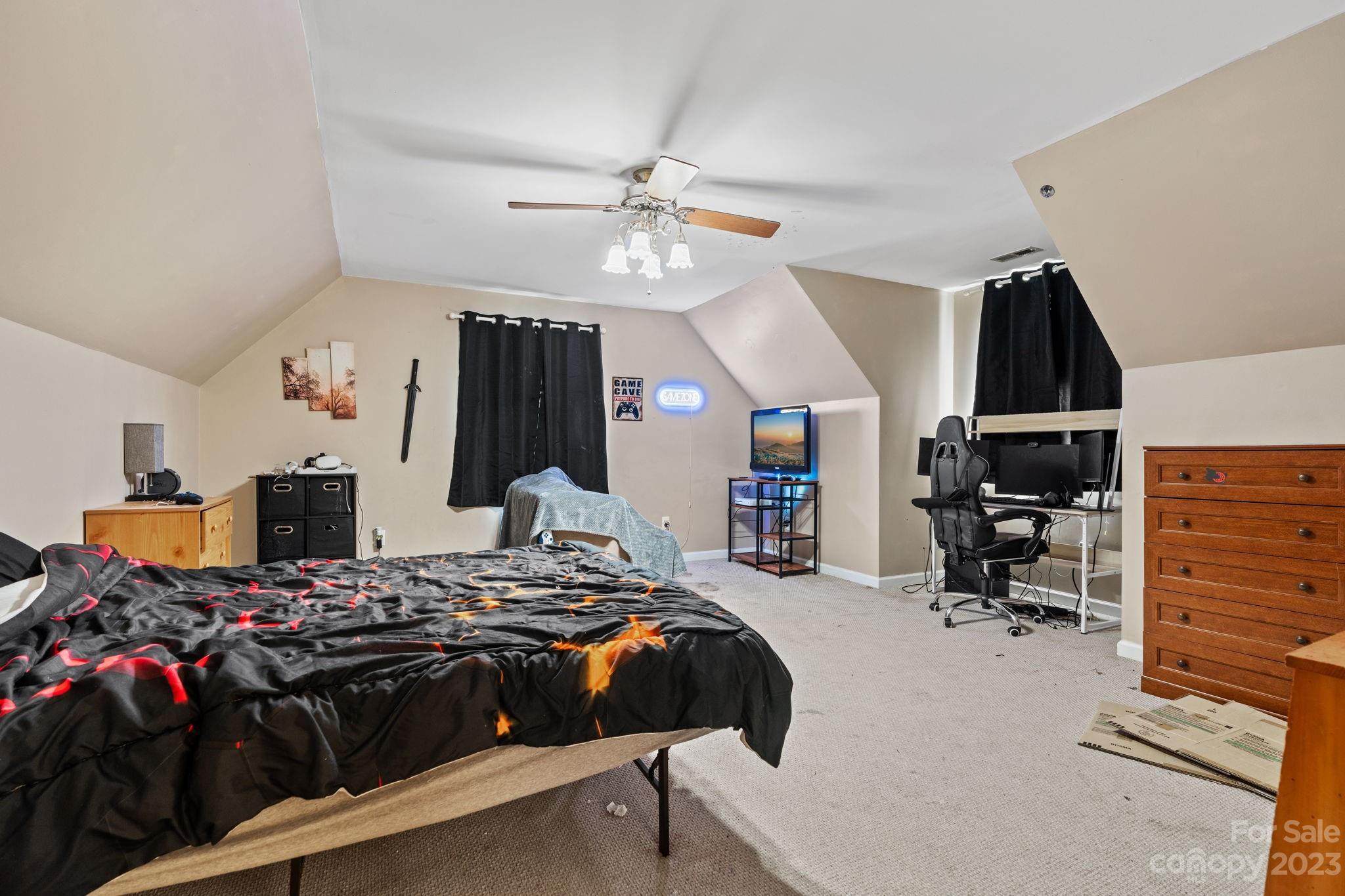 42 Bear Trail Fairview, NC 28730 - Photo 24 of 37 a bed room with a bed and gym equipment