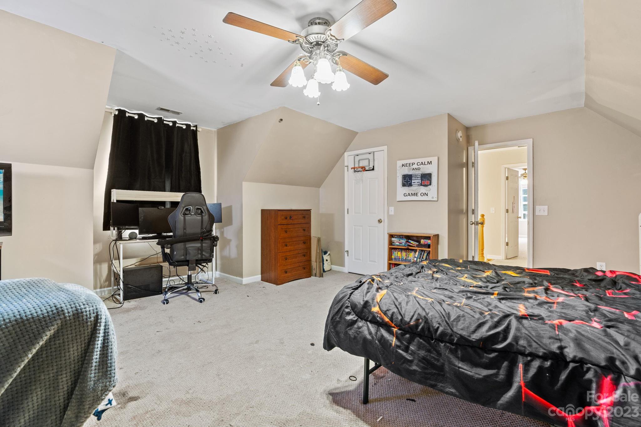 42 Bear Trail Fairview, NC 28730 - Photo 25 of 37 a bedroom with a bed and a chair