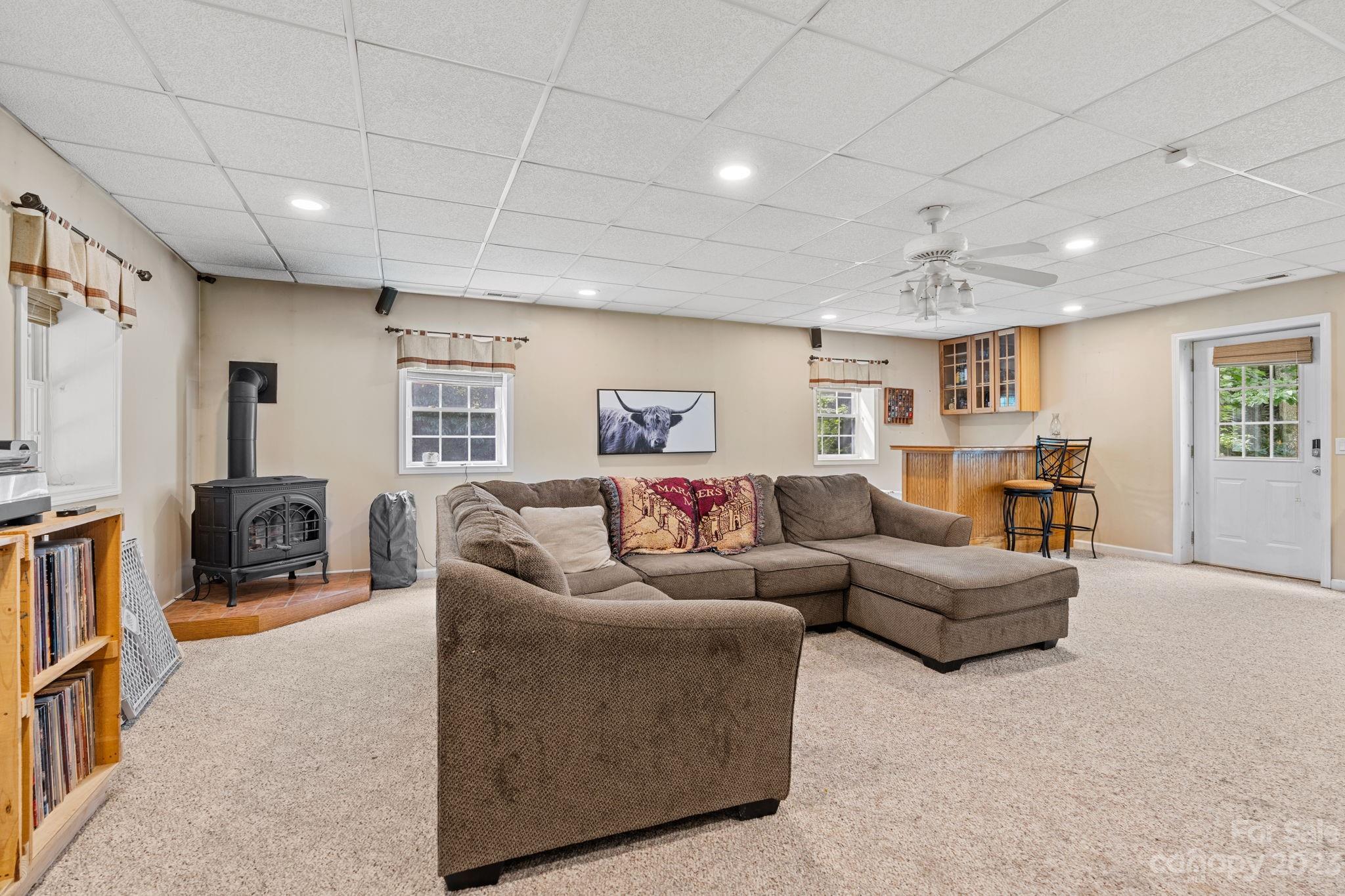42 Bear Trail Fairview, NC 28730 - Photo 27 of 37 a living room with furniture and a flat screen tv
